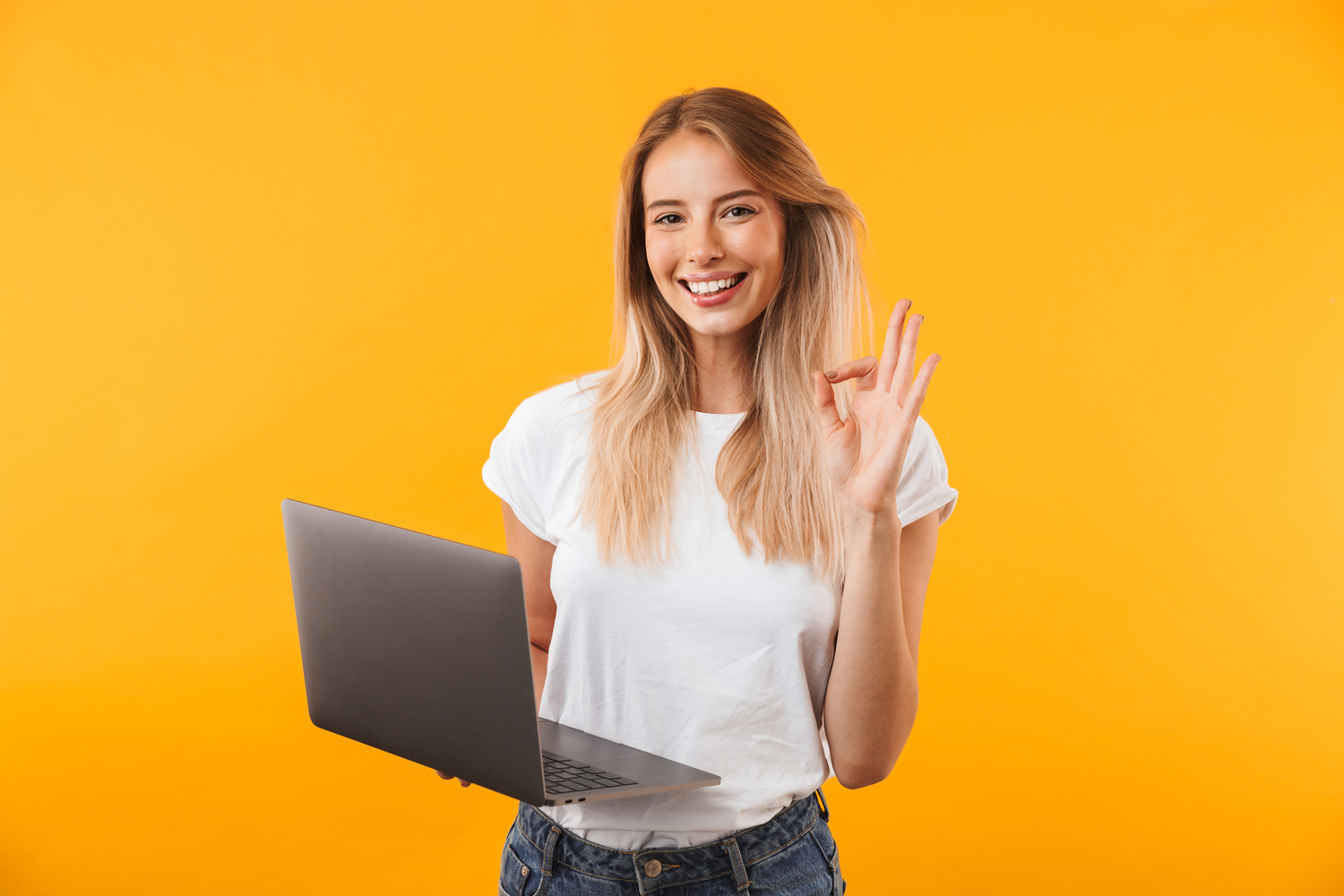 smiling woman with a laptop