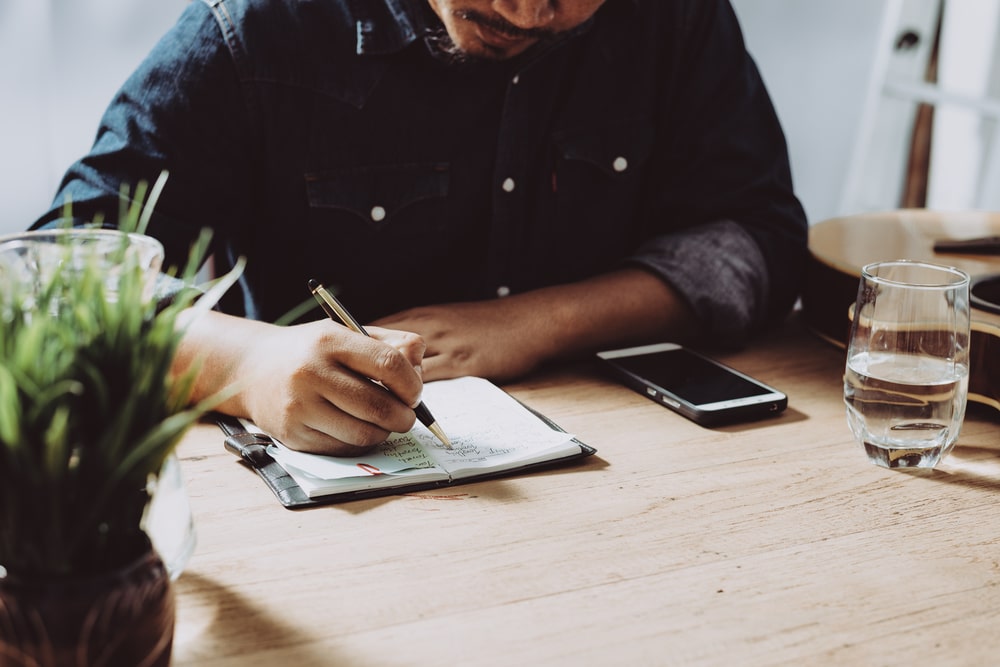 man with a notebook